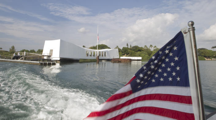 FILE - This Dec. 7, 2012 file photo shows The USS Arizona Memorial in Pearl Harbor, Hawaii. The CEO of a nonprofit organization that supports the National Park Service's operations in Pearl Harbor has been suspended while the group's board investigates allegations made in an anonymous letter. Pacific Historic Parks Board of Directors member and spokesman Jim Boersema said Wednesday, April 5, 2017, that Ray L'Heureux was placed on paid administrative leave last week. (AP Photo/Eugene Tanner, File)