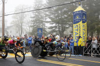 Women's wheelchair athlete Manuela Schar (W101), of Switzerland, breaks from the starting line with others during the 127th Boston Marathon, Monday, April 17, 2023, in Hopkinton, Mass. (AP Photo/Mary Schwalm)