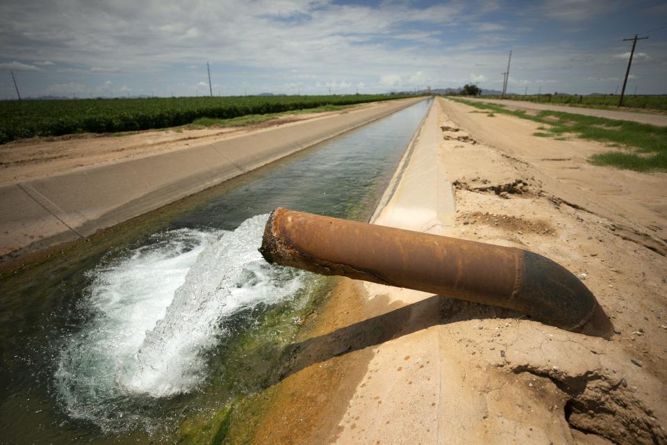 Groundwater flows into a CAP canal outside of Casa Grande on Aug. 13, 2021. Agricultural irrigation districts in Pinal County have secured state and federal funds to pay for drilling more wells to partially offset the loss of Colorado River water.