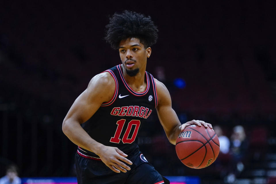 Georgia's Aaron Cook (10) looks to pass during the first half of an NCAA college basketball game against Northwestern Tuesday, Nov. 23, 2021, in Newark, N.J. (AP Photo/Frank Franklin II)