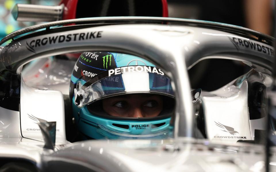 Mercedes driver George Russell of Britain sits in his car during the third practice session at the Singapore Formula One Grand Prix, at the Marina Bay City Circuit in Singapore, Saturday, Oct. 1, 2022 - AP