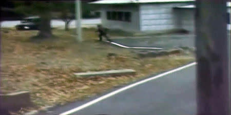 A CCTV footage shows a North Korean soldier crossing the white Military Demarcation Line during a United Nations Command (UNC) briefing on the investigation results of the soldier's defection, at the South Korean defence ministry in Seoul in this still image taken from a Reuters TV video, November 22, 2017. REUTERS/Reuters TV