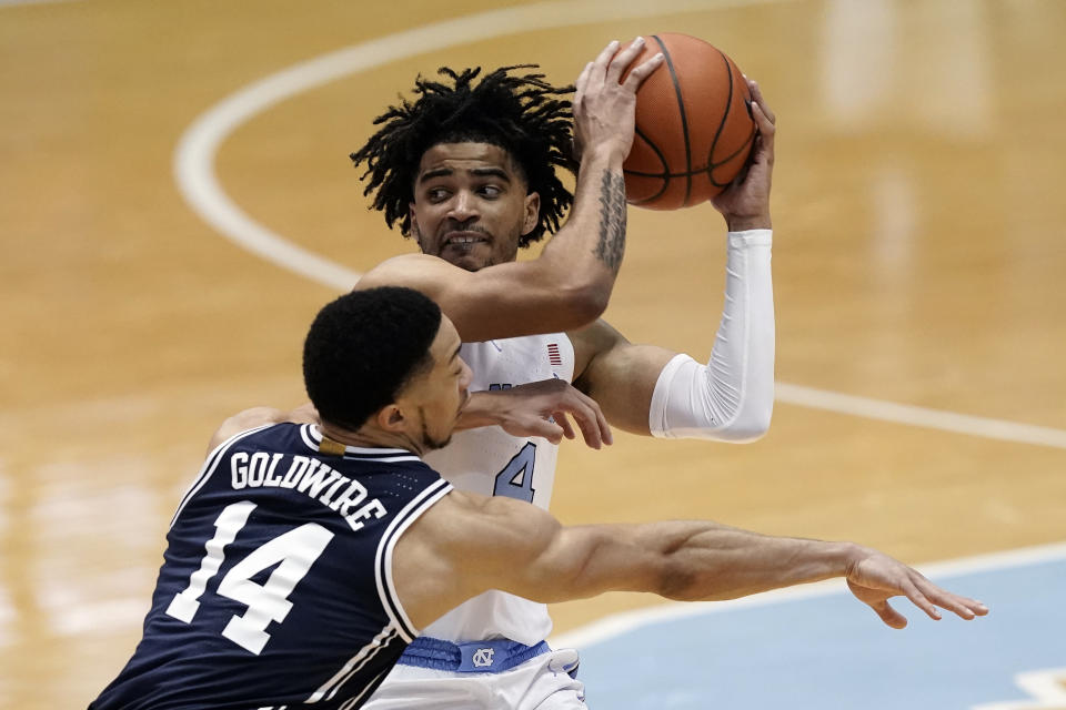 Duke guard Jordan Goldwire (14) defends against North Carolina guard R.J. Davis (4) during the first half of an NCAA college basketball game in Chapel Hill, N.C., Saturday, March 6, 2021. (AP Photo/Gerry Broome)