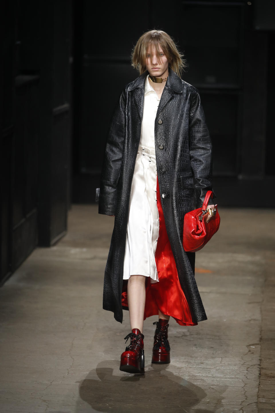 A model wears a creation as part of the Marni women's Fall-Winter 2019-2020 collection, that was presented in Milan, Italy, Thursday, Friday, Feb. 22, 2019. (AP Photo/Antonio Calanni)