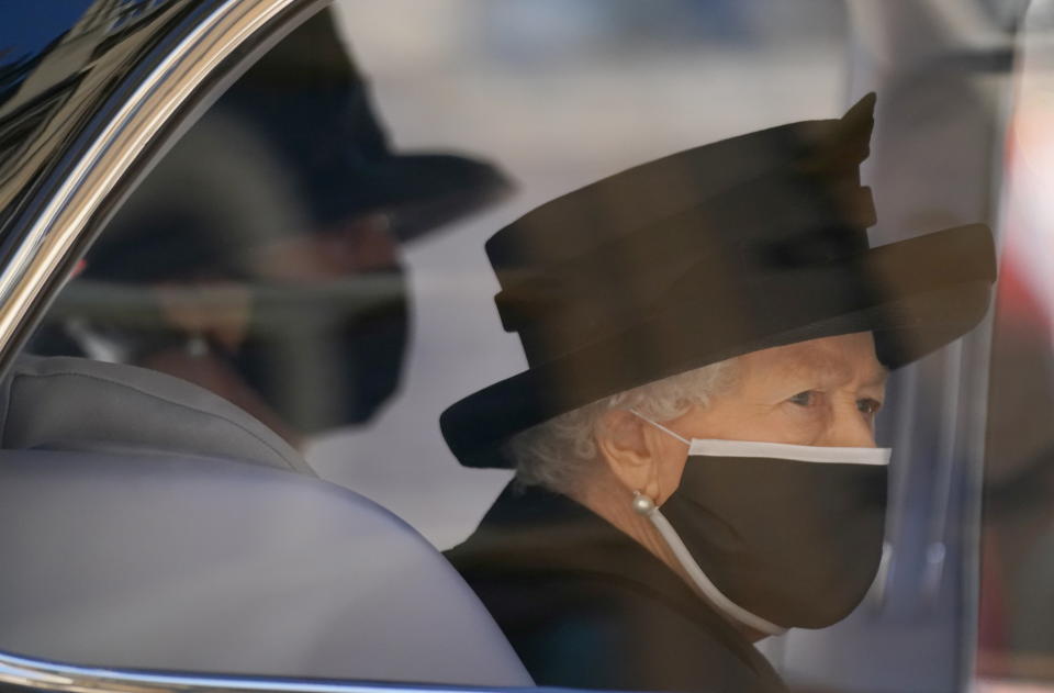 Britain's Queen Elizabeth II arrives for the funeral of Britain's Prince Philip, who died at the age of 99, at St George's Chapel, in Windsor, Britain, April 17, 2021. Victoria Jones/Pool via REUTERS