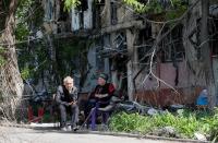 A view shows a damaged residential building in Mariupol