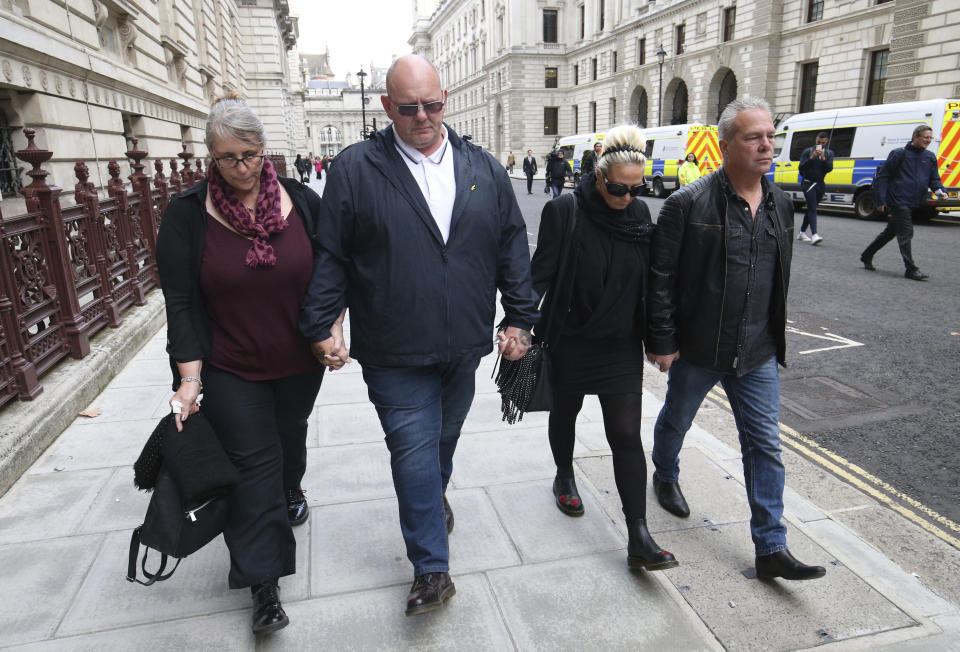 The family Harry Dunn, mother Charlotte Charles, second right, and father Tim Dunn, second left, arrive with their partners at the Foreign and Commonwealth Office in London, where they are meeting British Foreign Secretary Dominic Raab, Wednesday Oct. 9, 2019. The couple's son 19-year old Harry Dunn was killed in a road accident Aug. 27, involving an American diplomat's wife who left the country under Diplomatic Immunity after reportedly becoming a suspect in the fatal crash. (Jonathan Brady/PA via AP)