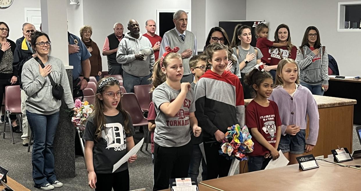 Students from Dover elementary schools lead the reciting of the Pledge of Allegiance at Monday's Dover City Council meeting.