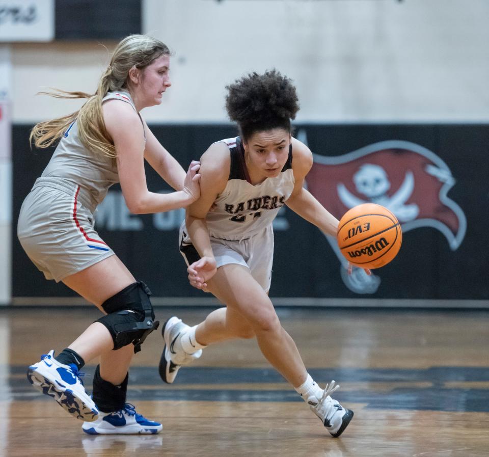Rachel  Leggett (24) brings the ball up court during the Pace vs Navarre girls basketball District 1-6A championship game at Navarre High School in Navarre on Friday, Feb. 4, 2022.