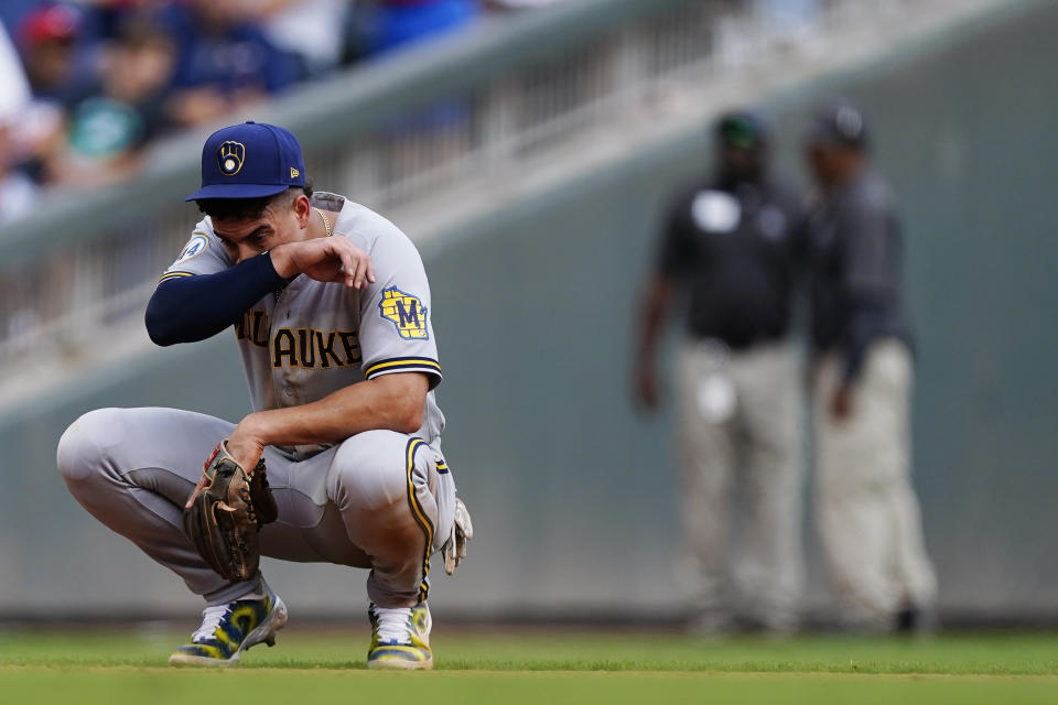 Milwaukee Brewers shortstop Willy Adames (27) waits for play to resume during the eighth inning of Game 3 of a baseball National League Division Series between the Atlanta Braves and the Milwaukee Brewers, Monday, Oct. 11, 2021, in Atlanta. (AP Photo/John Bazemore)