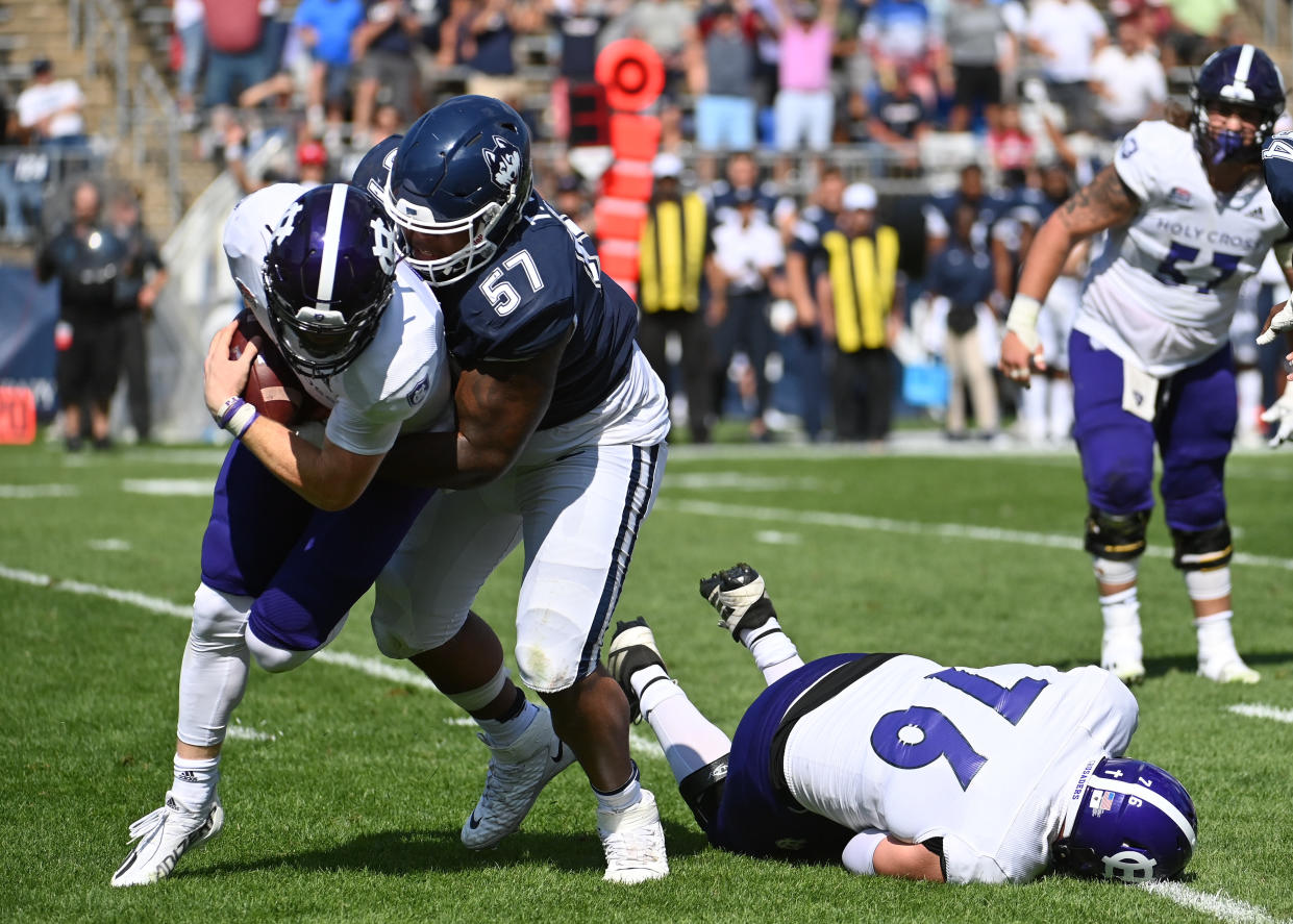Connecticut DT Travis Jones (57) can swallow up ballcarriers in a hurry. (Photo by Williams Paul/Icon Sportswire via Getty Images)