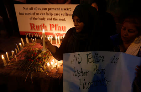 People light candles in memory of German-born nun Dr. Ruth Pfau, in Karachi, Pakistan August 19, 2017. REUTERS/Akhtar Soomro