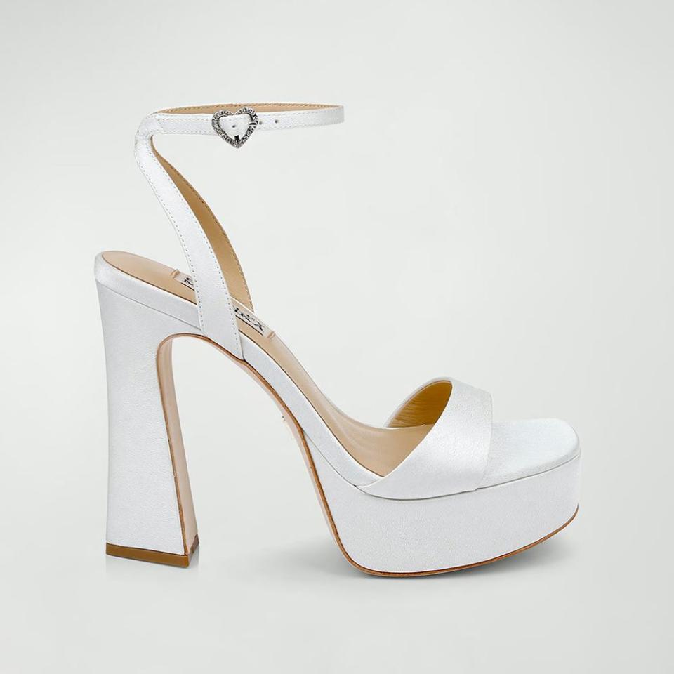 <p><a href="https://go.redirectingat.com?id=74968X1596630&url=https%3A%2F%2Fwww.neimanmarcus.com%2Fp%2Fbadgley-mischka-caia-crystal-heart-platform-sandals-prod267960480&sref=https%3A%2F%2Fwww.elle.com%2Ffashion%2Fshopping%2Fg39980280%2Fcomfortable-wedding-shoes%2F" rel="nofollow noopener" target="_blank" data-ylk="slk:Shop Now;elm:context_link;itc:0;sec:content-canvas" class="link ">Shop Now</a></p><p>Caia Crystal Heart Platform Sandals</p><p>Neiman Marcus</p><p>$245.00</p>