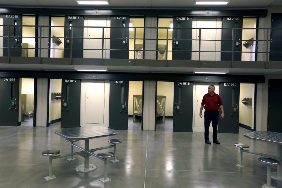 A man stands in a housing unit in the West section of the State Correctional Institution at Phoenix in Collegeville, Pa., in this June 1, 2018 file photo. The majority of this facility is air-conditioned, according to the Pennsylvania Department of Corrections.