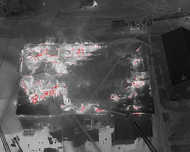 A infrared image taken by drone reveals fire hot spots after the Harborside Inn's roof had collapsed.