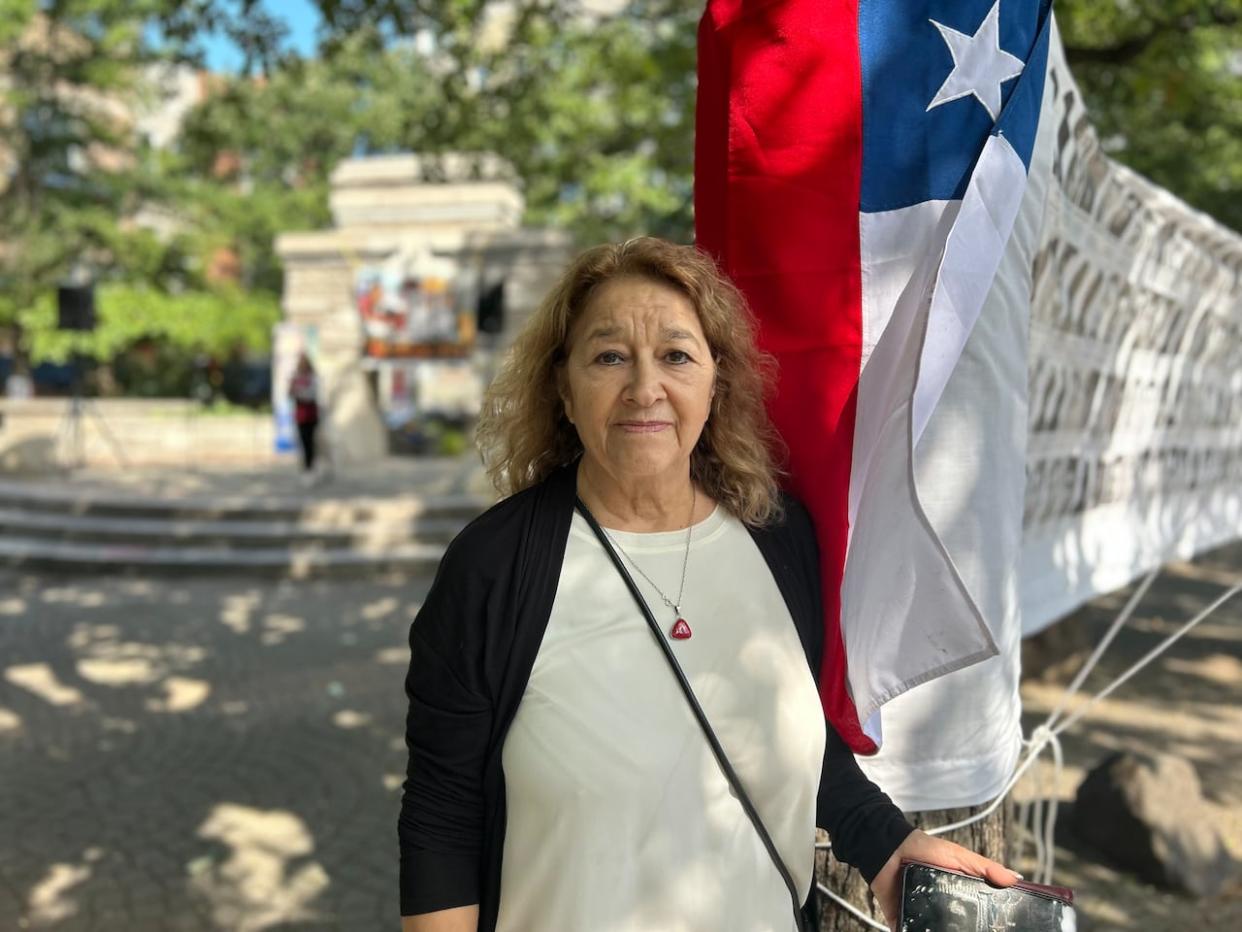 Hortensia Agurto gathered with members of the Chilean community in Montreal at a vigil Monday commemorating the 50 years since the start of the dictatorship that brought her here. (Shahroze Rauf/CBC - image credit)