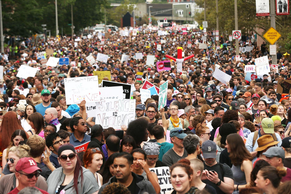 <p>Counter-protesters held up signs like "Silence is violence."</p>