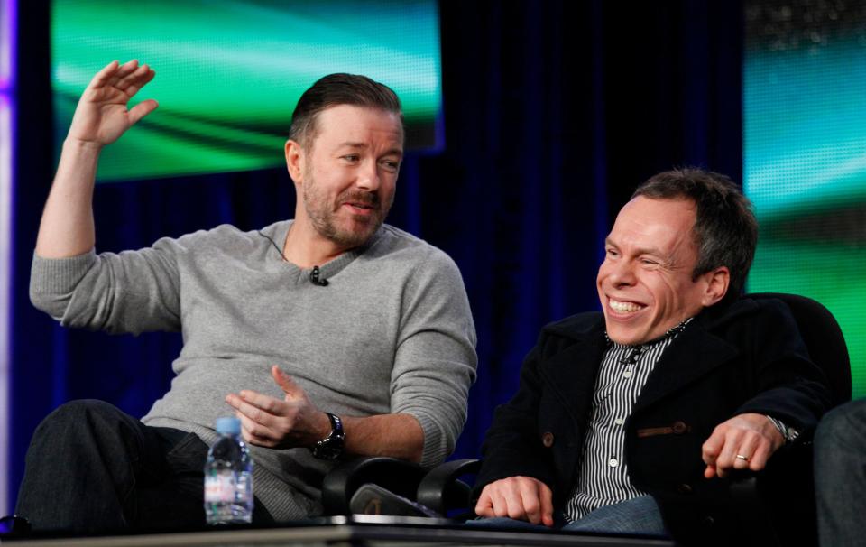 Cast members Ricky Gervais (L) and Warwick Davis attend the panel for the HBO television series 