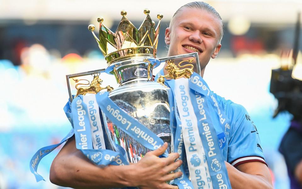 Erling Haaland holds the Premier League trophy - Premier League final 2023: how to watch in the US - Peter Powell/Shutterstock