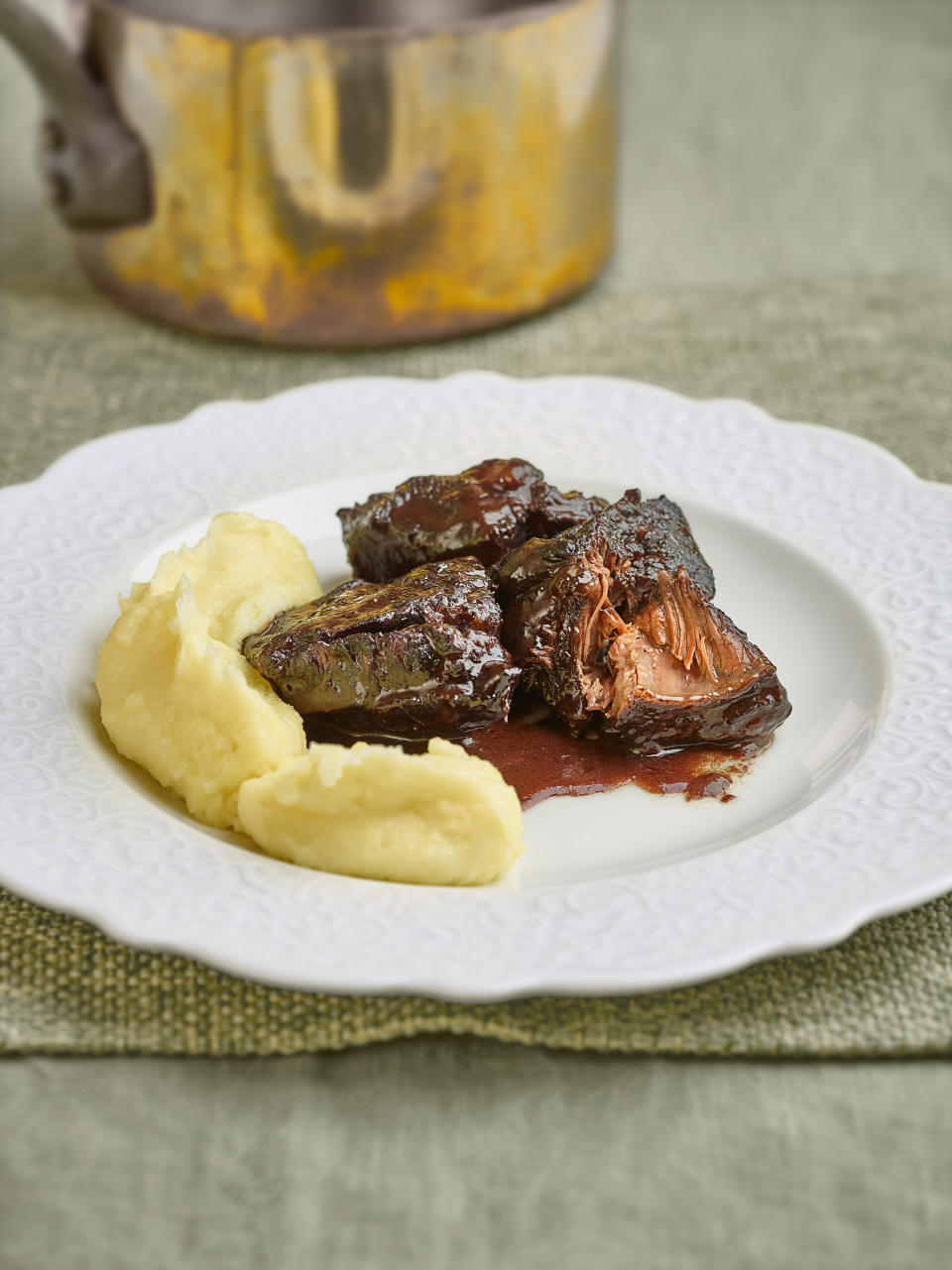 meat and mashed potatoes on a plate for main course