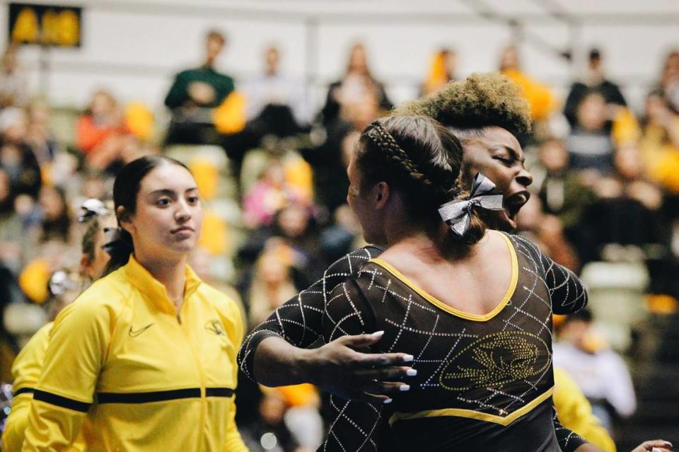 Amari Celestine hugs her teammate after a routine during the Missouri gymnastics meet against No. 10 Kentucky on Feb. 3, 2023, at the Hearnes Center in Columbia, Mo.