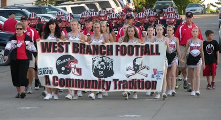 The West Branch football program marches from the school to the Little Rose Bowl — Facebook