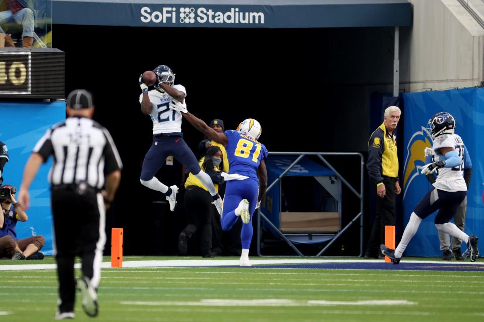 Dec 18, 2022; Inglewood, California, USA;  Tennessee Titans cornerback Roger McCreary (21) intercepts a pass for a touchback during the second quarter against the Los Angeles Chargers at SoFi Stadium.
