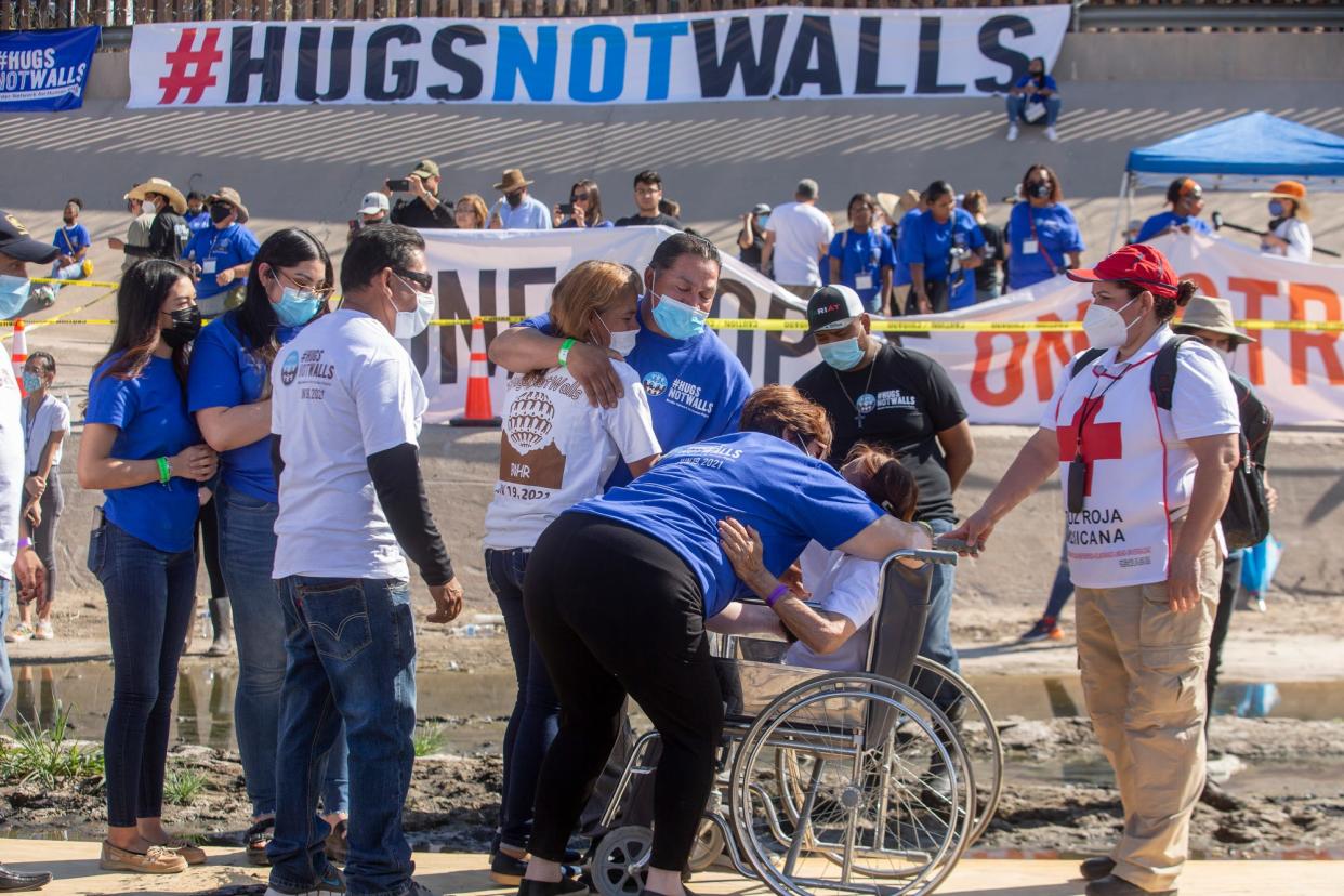 Families embraced on the Rio Grande between Ciudad Juárez, Mexico and El Paso, Texas during the 8th annual "Hugs not Walls" event which allowed Mexican immigrants with irregular status and unable to return to Mexico an opportunity to meet for a few minutes on the international border.