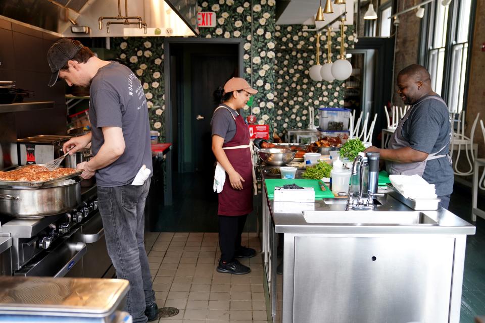 Chef de cuisine Nathan Penny, sous chef Stephanie Gonzales and chef Jeff Harris work in the kitchen, at Harris' Over-the-Rhine restaurant, Nolia. Harris was one of four Cincinnati chefs nominated as semifinalists for the coveted 2024 James Beard Awards. All were nominated in the same category, Best Chef/Great Lakes, which includes the states of Ohio, Michigan, Indiana and Illinois.