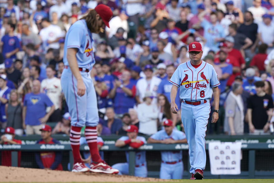 St. Louis Cardinals manager Mike Shildt, right, walks to the mound as starting pitcher John Gant looks down during the second inning of the team's baseball game against the Chicago Cubs in Chicago, Saturday, June 12, 2021. (AP Photo/Nam Y. Huh)