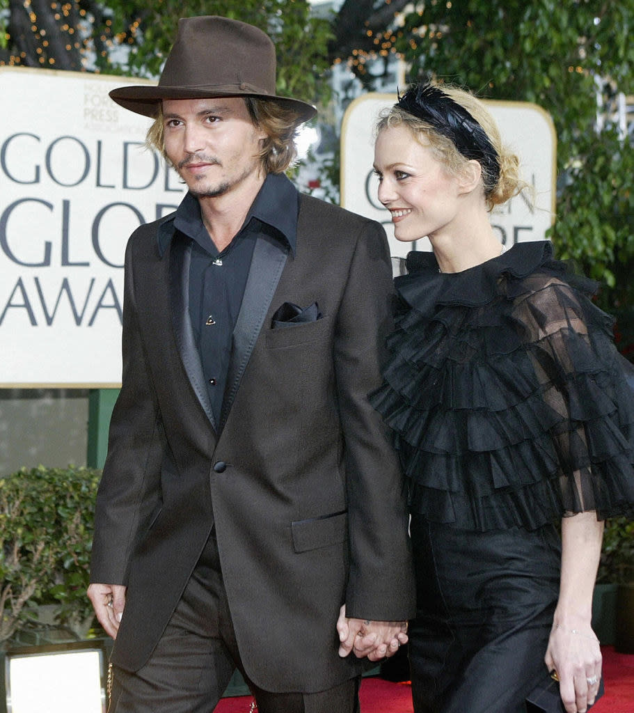 Johnny Depp and Vanessa Paradis holding hands on the red carpet