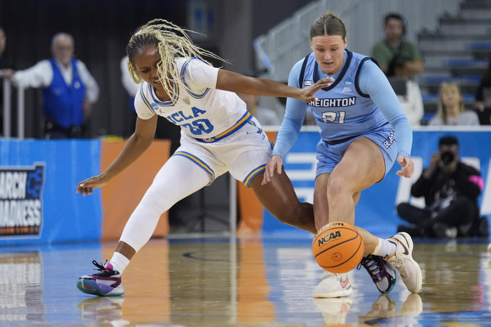 Creighton guard Molly Mogensen (21) and UCLA guard Charisma Osborne (20) vie for a loose ball during the first half of a second-round college basketball game in the women's NCAA Tournament Monday, March 25, 2024, in Los Angeles. (AP Photo/Marcio Jose Sanchez)