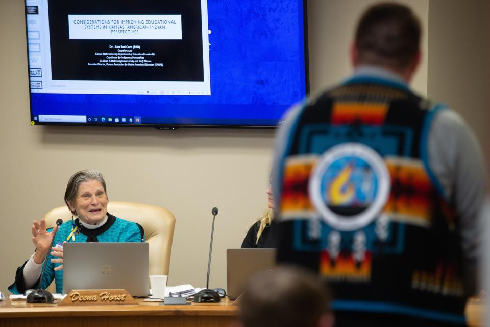 Deena Horst, Kansas State Board of Education board member, asks a question to Raphael Wahwassuck, a member of the Prairie Band Potawatomi Nation tribal council, during Wednesday's meeting.