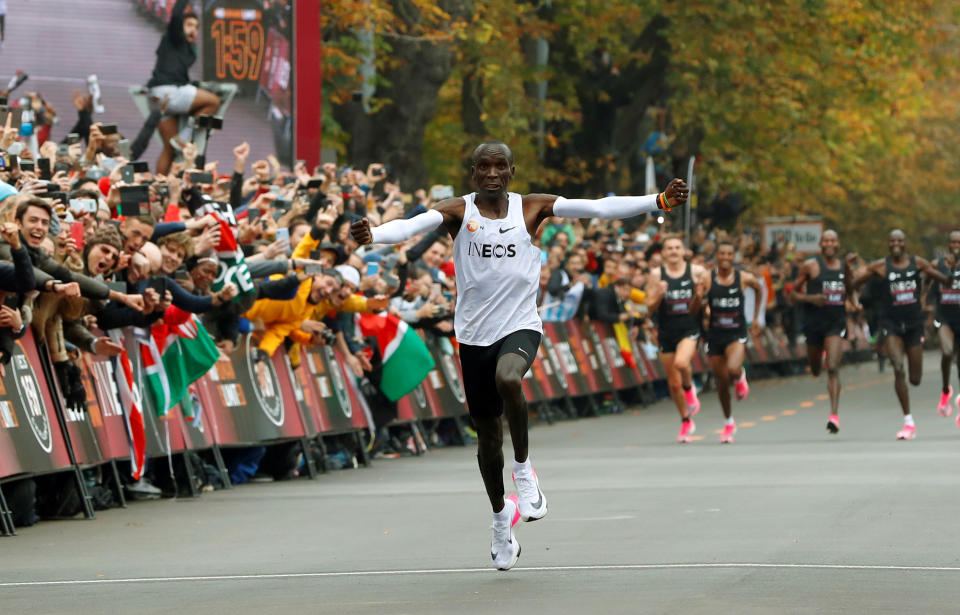Kenya's Eliud Kipchoge, the marathon world record holder, crosses the finish line during his attempt to run a marathon in under two hours in Vienna, Austria, October 12, 2019. (REUTERS/Leonhard Foeger)