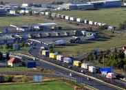 Vans and trucks wait to be checked by Austrian border officials on the M1 highway in front of the former border station of Hegyeshalom, on August 31, 2015