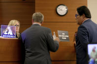 Judge Corey Amanda Cawthon speaks with defense attorneys Lorne Berkeley, left, and Eric Schwartzreich, representing NFL free agent Antonio Brown during a first appearance hearing, Friday, Jan. 2,4 0202, at the Broward County Courthouse in Fort Lauderdale, Fla. Brown was granted bail on Friday after turning himself in at a Florida jail on charges that he and his trainer attacked the driver of a moving truck that carried some of his possessions from California. (Amy Beth Bennett/South Florida Sun Sentinel via AP, Pool)