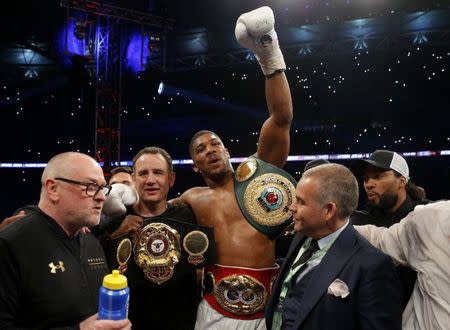 Britain Boxing - Anthony Joshua v Wladimir Klitschko IBF, IBO & WBA Super World Heavyweight Title's - Wembley Stadium, London, England - 29/4/17 Anthony Joshua celebrates with trainer Robert McCracken after winning the fight Action Images via Reuters / Andrew Couldridge Livepic