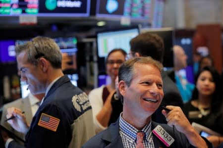 Traders work on the floor of the New York Stock Exchange shortly after the opening bell in New York