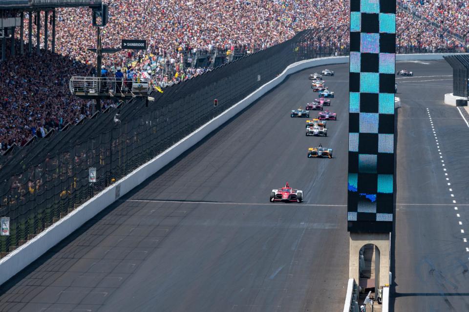 Marcus Ericsson crosses the finish line to win Sunday at the Indianapolis Motor Speedway.