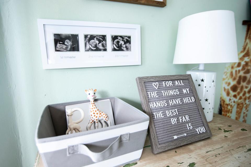 A sign in the home of NICU nurse Stephanie Amundson reads, "For all the things my hands have held, the best by far is you."