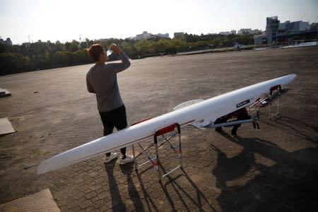 Rower Ha Jae-hun drinks water after a practice session at Misari Rowing Stadium in Hanam