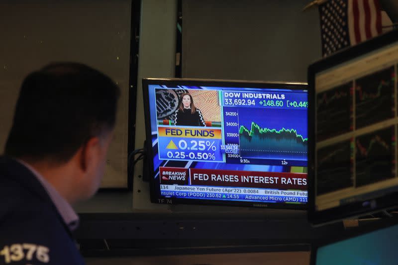 Traders work on the floor of the NYSE in New York