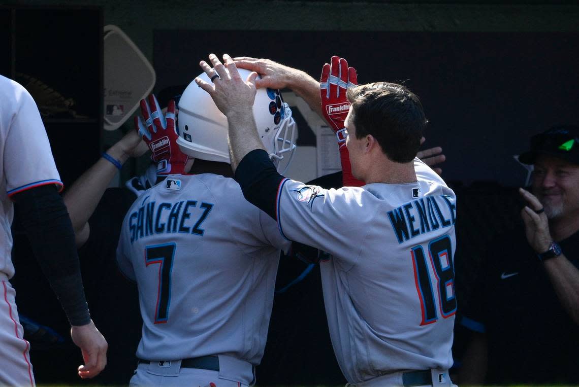 Miami Marlins’ Jesus Sanchez (7) celebrates his two-run home run with Joey Wendle (18) during the ninth inning of a baseball game, Sunday, July 3, 2022, in Washington. (AP Photo/Nick Wass)