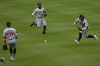 A ball hit by Baltimore Orioles' Ryan Mountcastle falls between Minnesota Twins' shortstop Willi Castro (50), left fielder Manuel Margot (13), and center fielder Austin Martin (82) for a single during the seventh inning of a baseball game, Wednesday, April 17, 2024, in Baltimore. The Orioles won 4-2. (AP Photo/Jess Rapfogel)