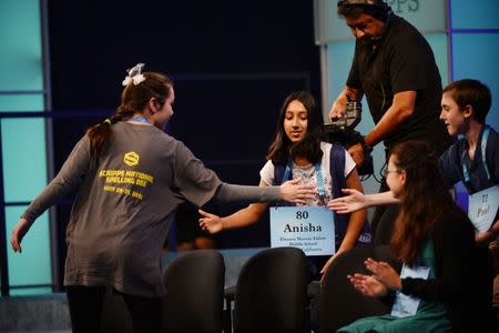 May 31, 2018; National Harbor, MD, USA; Marisa Langley from Florida greets other spellers as she walks off the stage after she spelled the word hausen incorrectly during the 2018 Scripps National Spelling Bee at the Gaylord National Resort and Convention Center. Mandatory Credit: Sean Dougherty-USA TODAY NETWORK