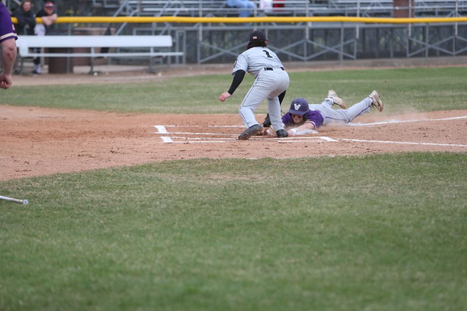 Aberdeen pitcher Brock Martin attempts to tag a Watertown runner at home plate during a May 5 game at Fossum Field. American News file photo