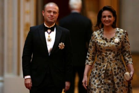 FILE PHOTO: Malta's Prime Minister Joseph Muscat and his wife Michelle arrive to attend The Queen's Dinner during The Commonwealth Heads of Government Meeting at Buckingham Palace in London on April 19, 2018.  Daniel Leal-Olivas/Pool via Reuters/File Photo