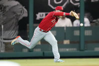 Cincinnati Reds center fielder Jake Fraley (27) misplays a fly ball from Atlanta Braves' Austin Riley in the fourth inning of a baseball game Friday, April 8, 2022, in Atlanta. (AP Photo/John Bazemore)
