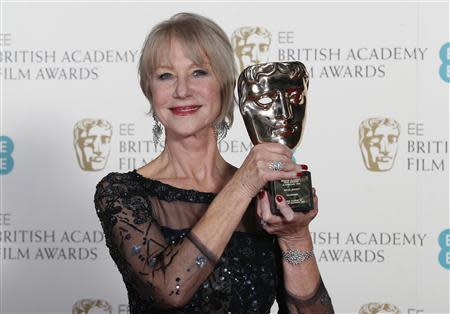 Helen Mirren celebrates winning the Fellowship award at the British Academy of Film and Arts (BAFTA) awards ceremony at the Royal Opera House in London February 16, 2014. REUTERS/Suzanne Plunkett