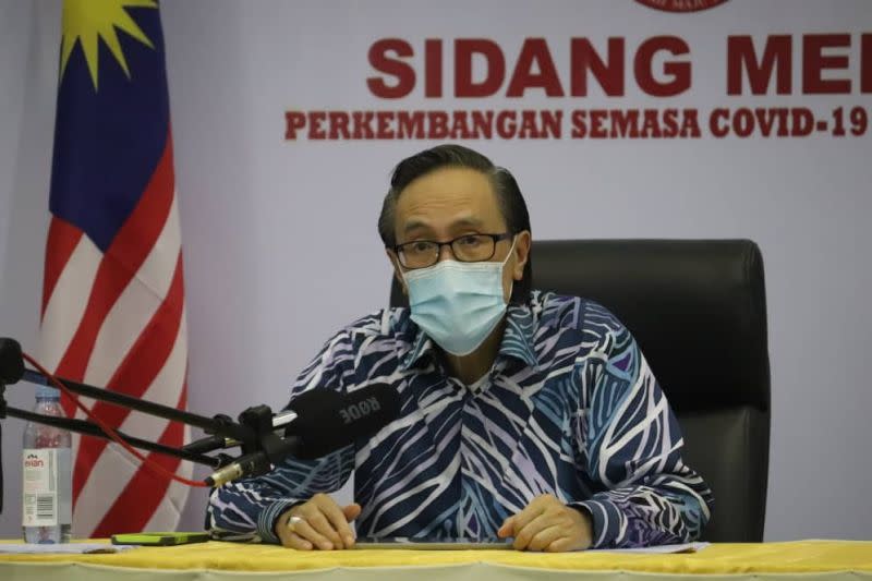 Datuk Seri Masidi Manjun said that the state Health Department will assist private clinics to set up the immunisation programme . — Borneo Post pic